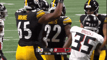 a football game between the steelers and the falcons is being played