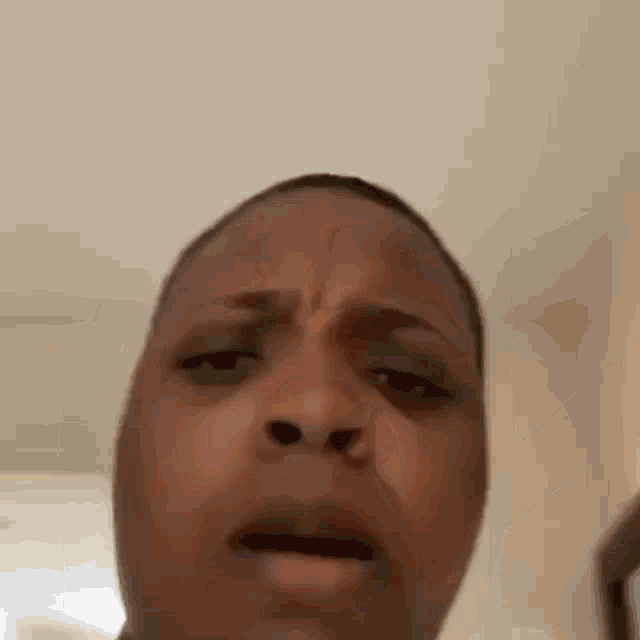 a close up of a man 's face with a funny face .