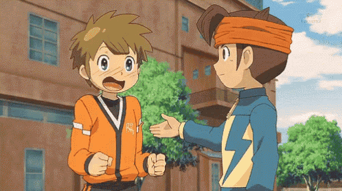 a boy in an orange jacket talks to another boy in a blue jacket with a lightning bolt on it