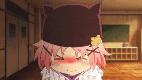 a girl with pink hair wearing a cat hat