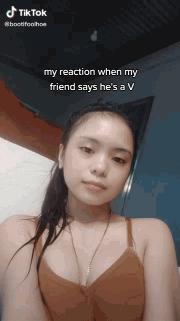 a girl 's face is shown with a caption that says my reaction when my friend says he 's a v