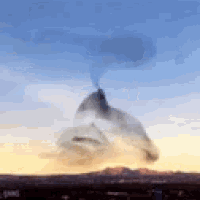 a mountain with smoke coming out of it 's chimney
