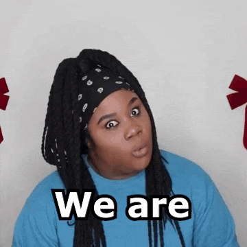 a woman with dreadlocks wearing a bandana and a blue shirt says we are