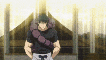 a man in a black shirt is holding a purple snake