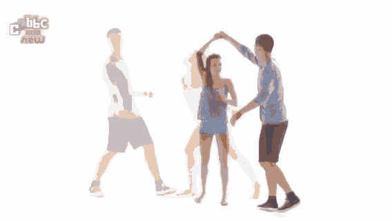 a man and a woman are standing next to each other .