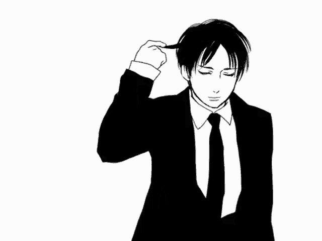 a man in a suit and tie is brushing his hair .