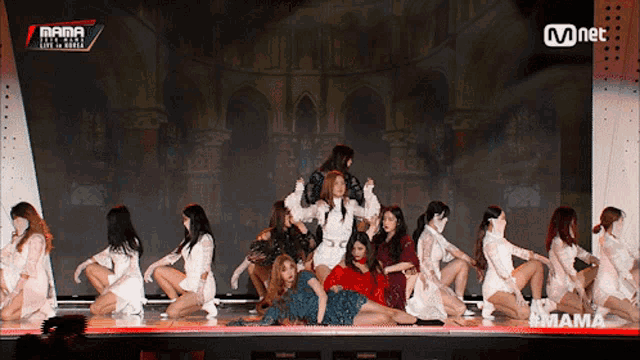 a group of women are dancing on a stage with the words mama on the bottom