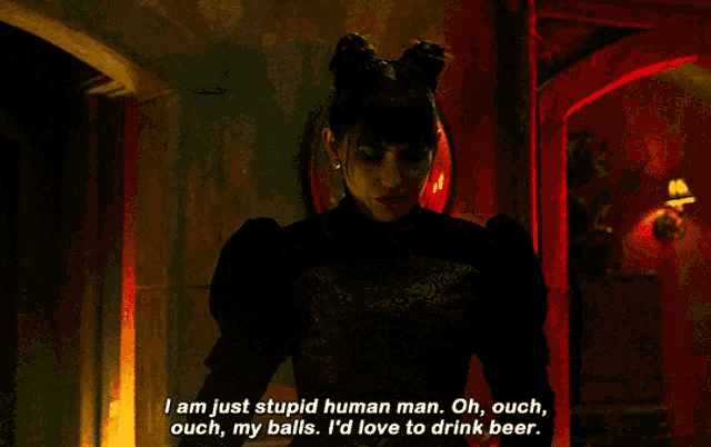 a woman in a black dress is saying i am just stupid human man oh ouch my balls i 'd love to drink beer