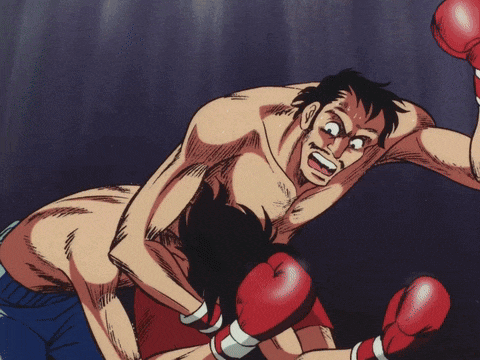 a man in red boxing gloves is being punched