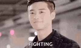 a close up of a man 's face with the word fighting on it .