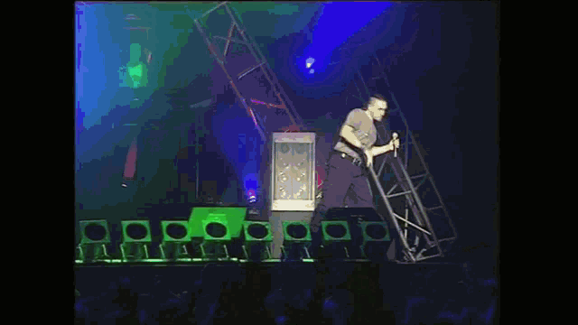 a person is playing a keyboard with a green light behind them