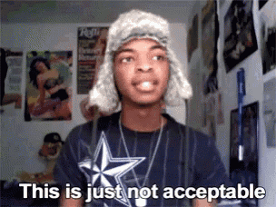 a man wearing a hat and a t-shirt says " this is just not acceptable "