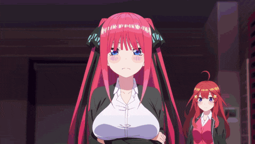 a girl with red hair is standing next to another girl with red hair .