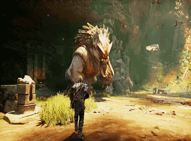 a video game shows a man standing next to a monster