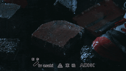 a tv asahi adk logo is displayed above a broken piece of paper