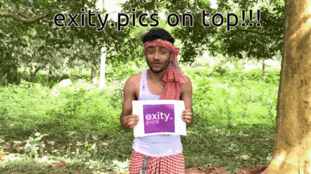 a man is holding up a sign that says exity pics on top