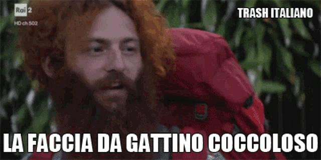 a man with red hair and a beard is on a tv screen with the words trash italiano on it