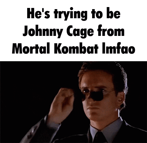 a man wearing sunglasses and a suit says he 's trying to be johnny cage from mortal kombat imfao .