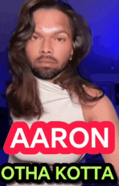 a man with long hair and a beard is wearing a white tank top with the name aaron on it