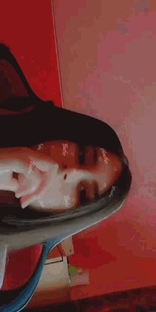 a close up of a girl 's face with hearts on it and the word barbie on her forehead .