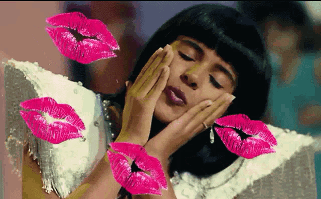 a woman blowing a kiss with pink lips coming out of her mouth