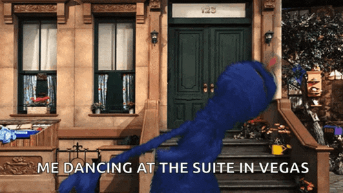 elmo is dancing at the suite in vegas in front of a building