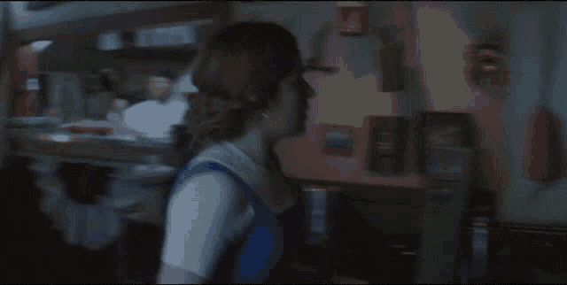a blurry picture of a woman taking a picture with a camera
