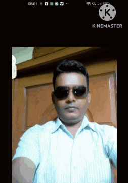 a man wearing sunglasses takes a selfie on a cell phone