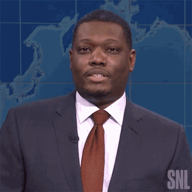 a man in a suit and tie has the word finally on his face