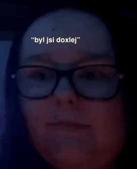 a woman wearing glasses has the words " byl jsi doxlej " written on her forehead
