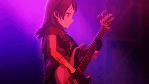 a girl playing a bass guitar in a dark room