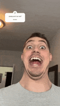 a man is making a funny face with a sticker that says jump on it or no answer