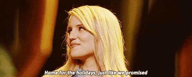 a woman with blonde hair is smiling and saying home for the holidays just like we promised