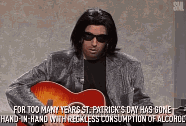 a man playing a guitar with the words " for too many years st. patrick "