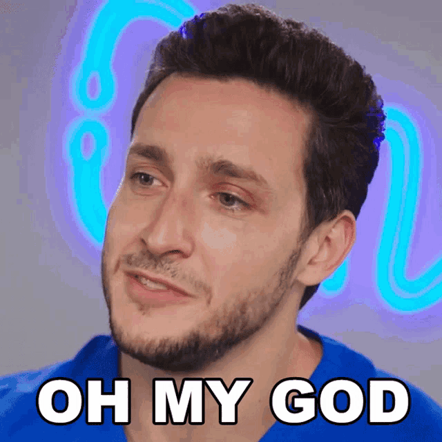 a man with a beard says oh my god in white letters