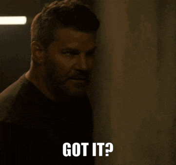 a man is standing in a hallway and says got it ?