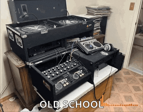 a bunch of old school equipment sitting on top of each other