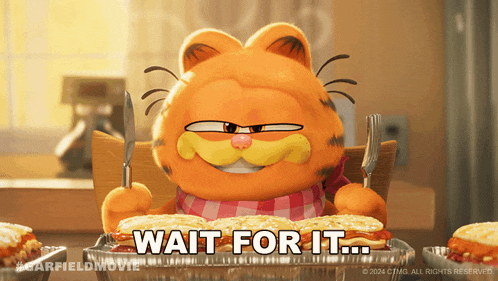 garfield is sitting at a table with a plate of food and the words wait for it below him