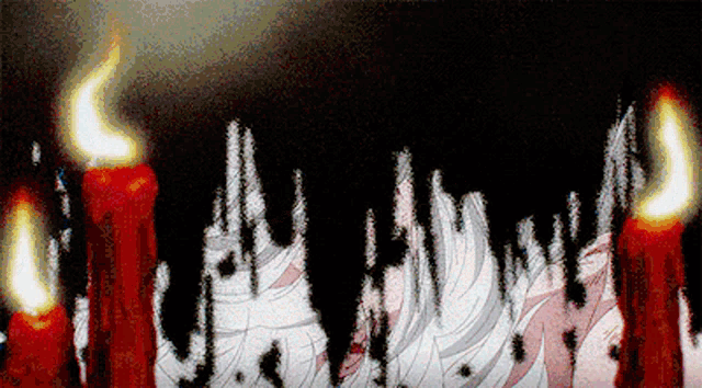 a bunch of candles are lit up in the dark