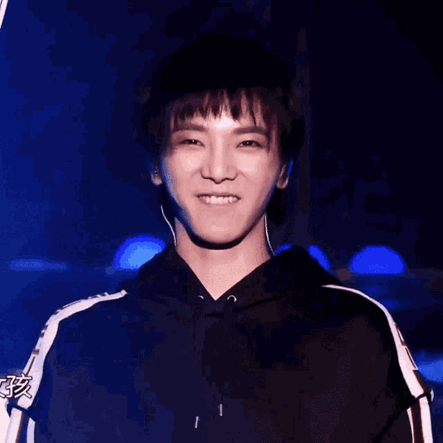 a close up of a person 's face with a blue background