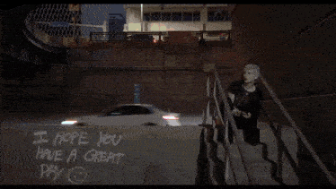 a person wearing a hoodie that says gpnb iicl on it