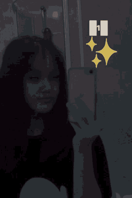 a girl is taking a picture of herself in a mirror with the number 1 in the background