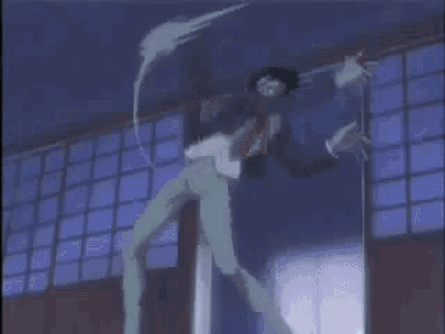 a person is standing in a circle with a sword in their hand in front of a building .
