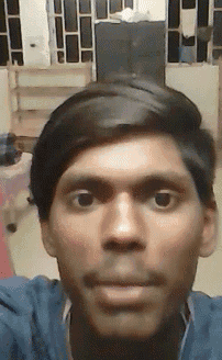 a close up of a man 's face with a blurred background