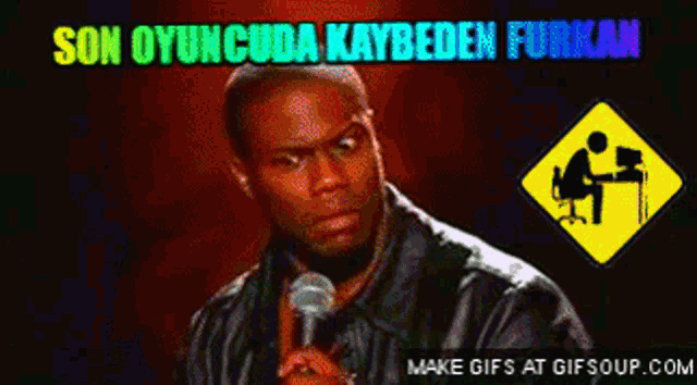 a man is holding a microphone in front of a yellow sign that says son oyuncuda kaybeden furkan