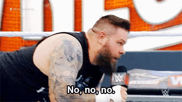 a man in a wrestling ring says no , no , no