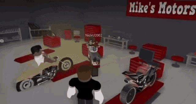a man is standing in a room with motorcycles and a sign that says mike 's hot