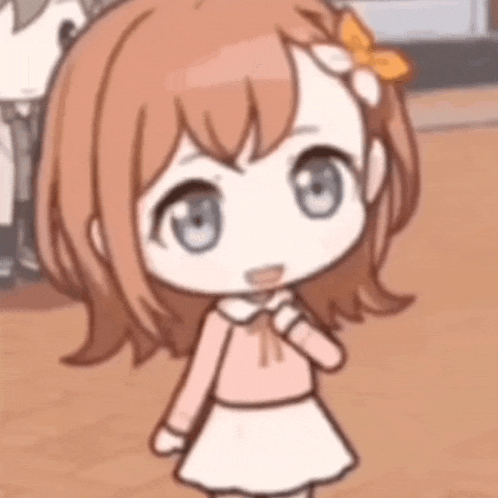 a little girl with brown hair and blue eyes is wearing a pink shirt and white skirt .