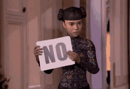a girl holding a sign that says no