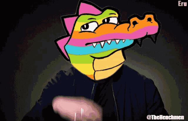 a cartoon drawing of a colorful crocodile with the username @thehenchmen at the bottom